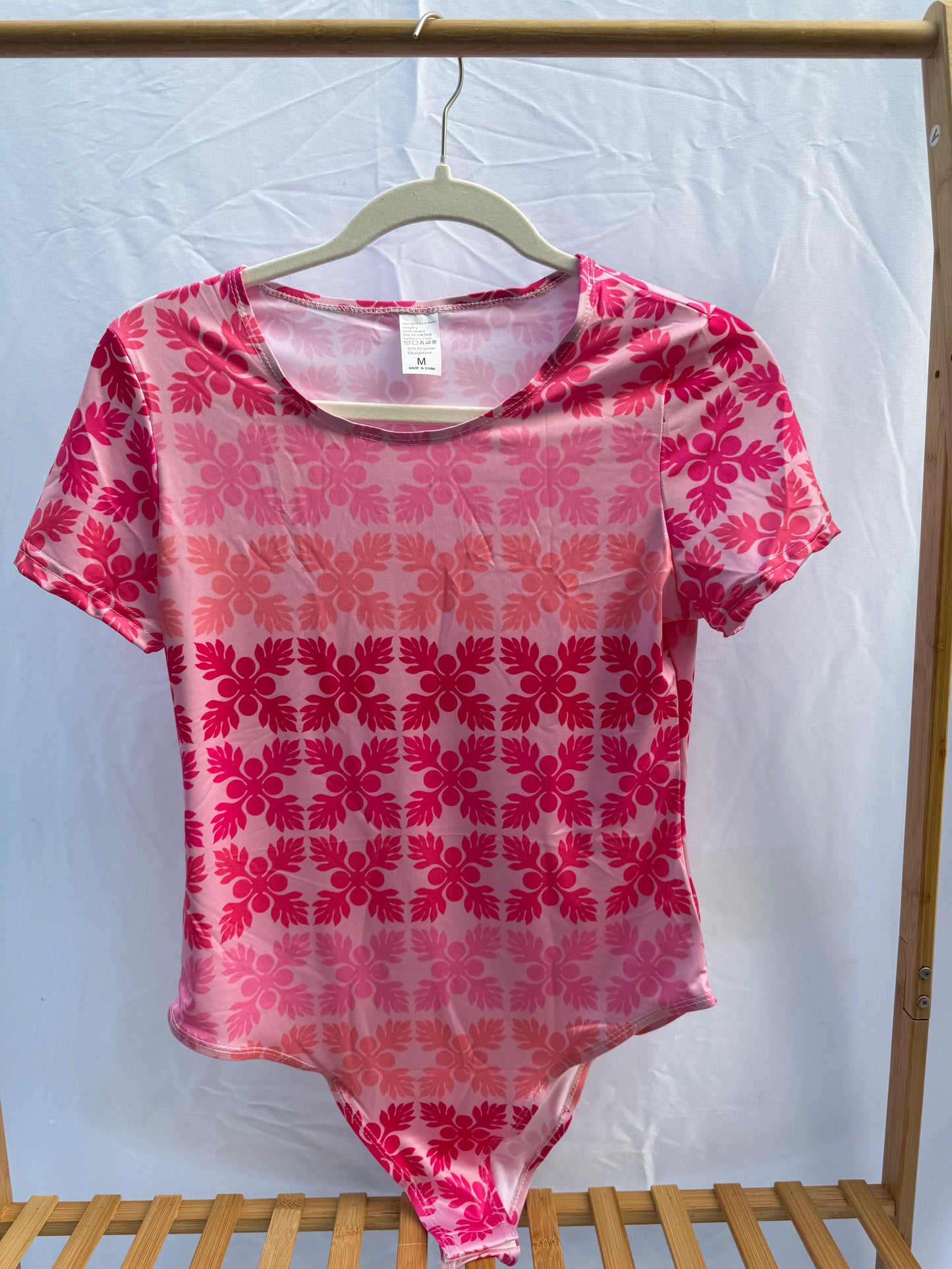 Pink kuiki bodysuit